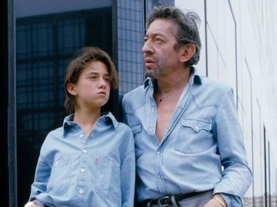 The picture shows Charlotte Gainsbourg and Serge Gainsbourg leaning onto each other as they look across at matching outfits.